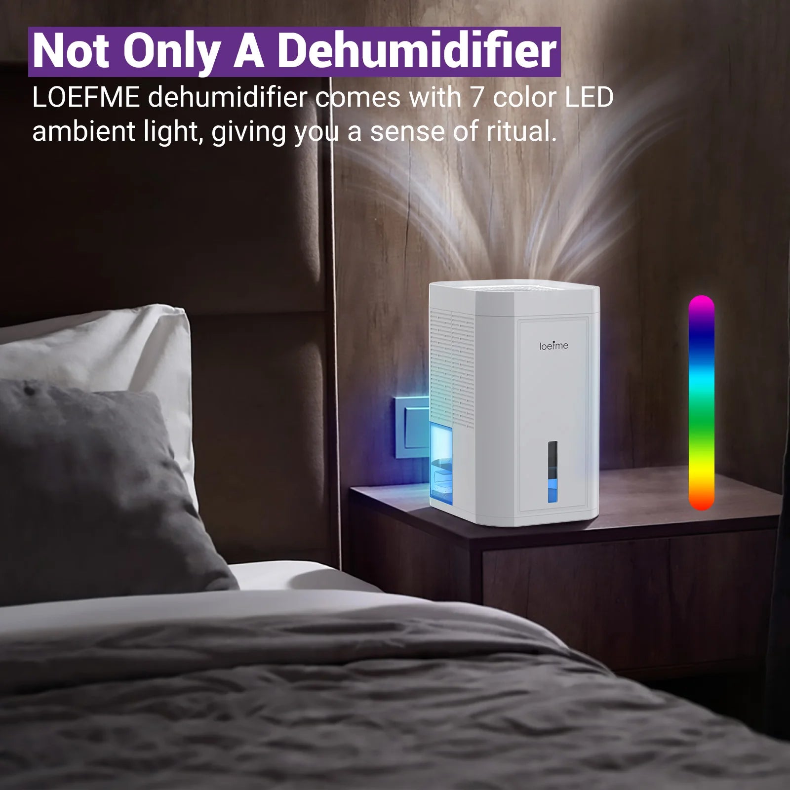Loeffme electric home dehumidifier with 7 colour LED ambient light on a bedside table