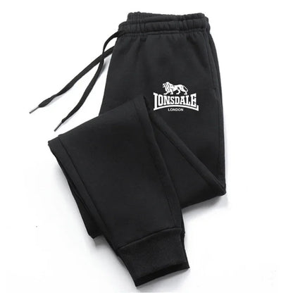 Black Lonsdale London sweatpants folded showing logo on pocket for streetwear tracksuits mens