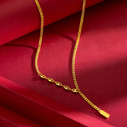 Lucky sign gold bar necklace with elegant chain design on a red background