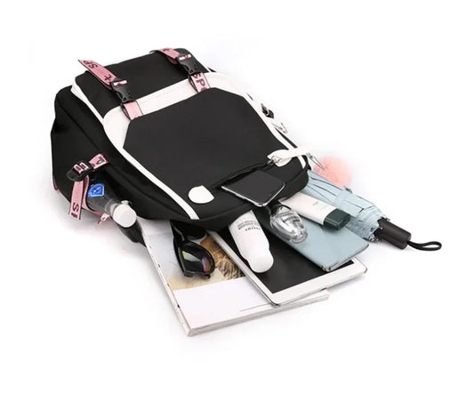 Black and white 2025 Demon Hunters Student Laptop Bag with pink straps open showing umbrella water bottle tablet and notebooks