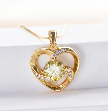 Elegant moissanite heart pendant necklace in gold with sparkling accents for a romantic gift