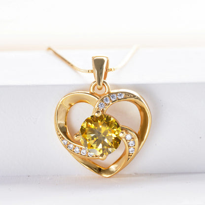 Luxurymania24 moissanite heart pendant necklace in gold with a yellow centre stone and sparkling accents