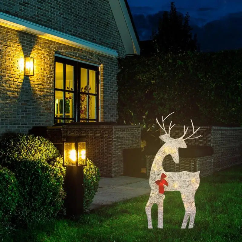 Outdoor glowing elk Christmas ornament with a red bow, perfect for festive outdoor decor