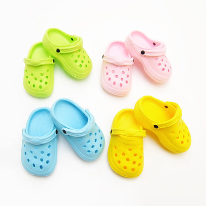 Colourful pet shoes for dogs and cats in pink, blue, yellow, and green for comfortable pet footwear