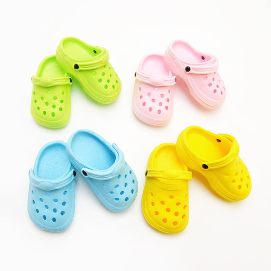 Colourful pet shoes for dogs and cats in pink, blue, yellow, and green for comfortable pet footwear