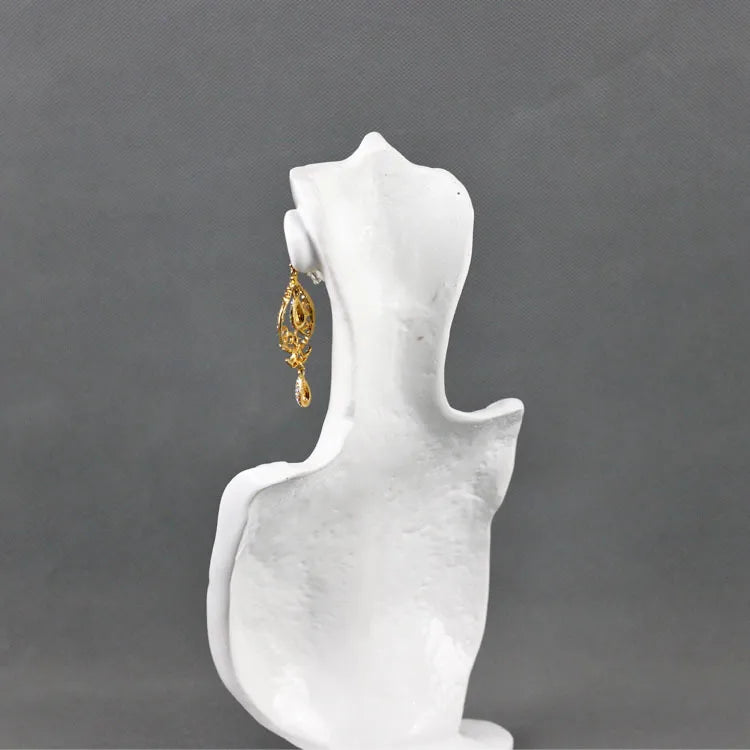 Elegant white resin jewellery display stand showcasing a dangling earring design