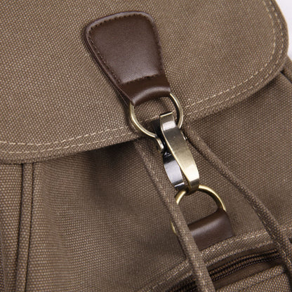 Close-up of retro girls fashion backpack with a brown leather strap and metal clasp detailing