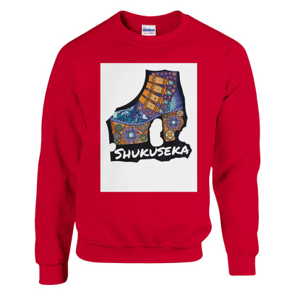 Red classic heavy blend sweatshirt featuring a vibrant graphic design with the word Shukujeka