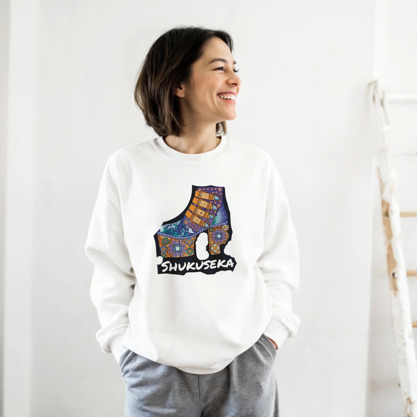 Woman smiling in a white classic heavy blend sweatshirt featuring a vibrant shoe graphic design