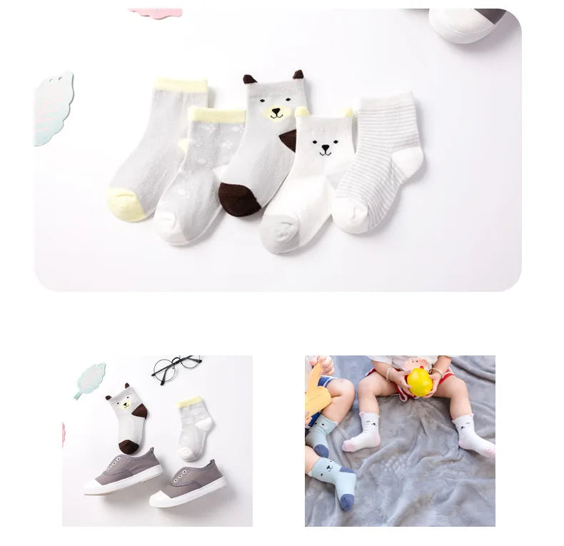 Collection of soft toddler socks for boys and girls featuring playful animal designs and various colours