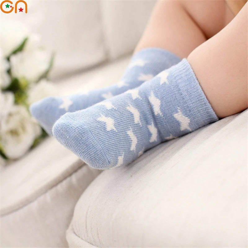 Blue soft toddler socks for boys and girls with white pattern, perfect for comfort and style