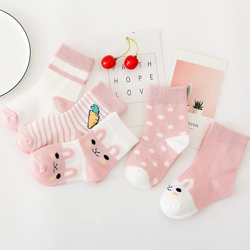 Collection of soft toddler socks for boys and girls featuring cute designs and vibrant colours