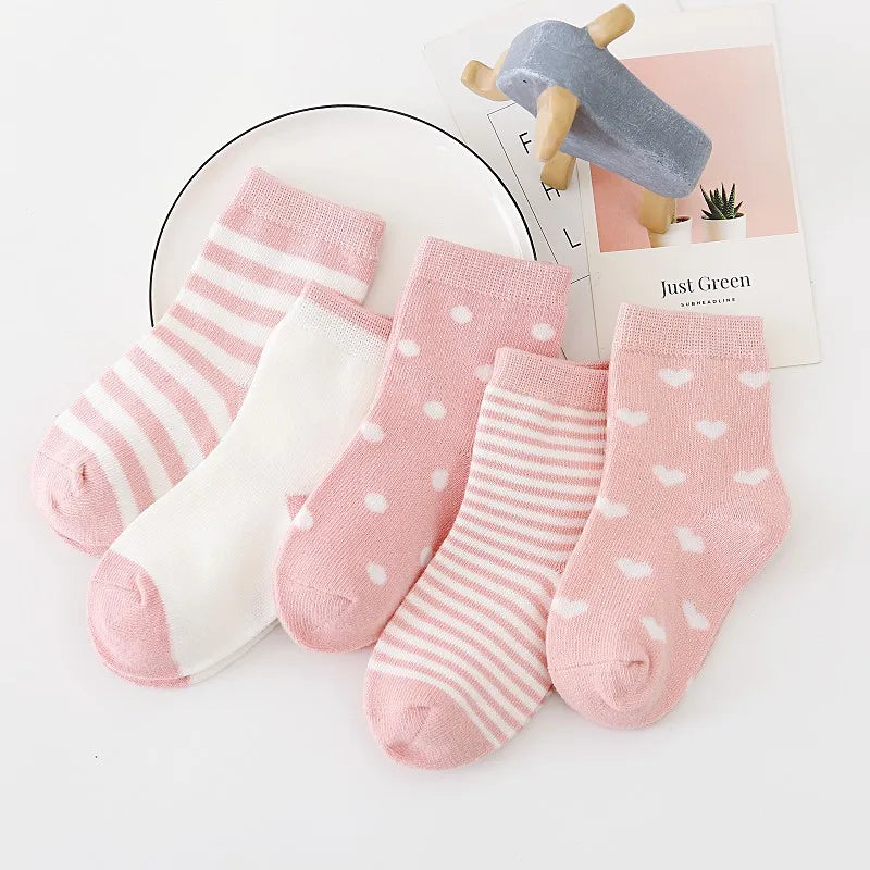 Set of soft toddler socks for boys and girls in pink with stripes and polka dots