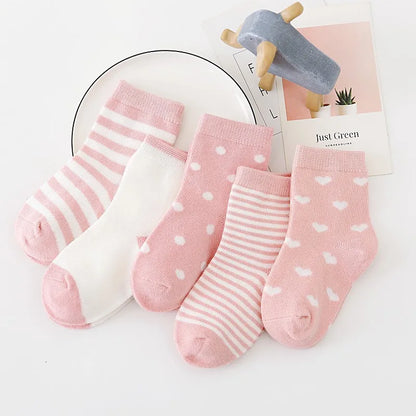 Set of soft toddler socks for boys and girls in pink with stripes and polka dots