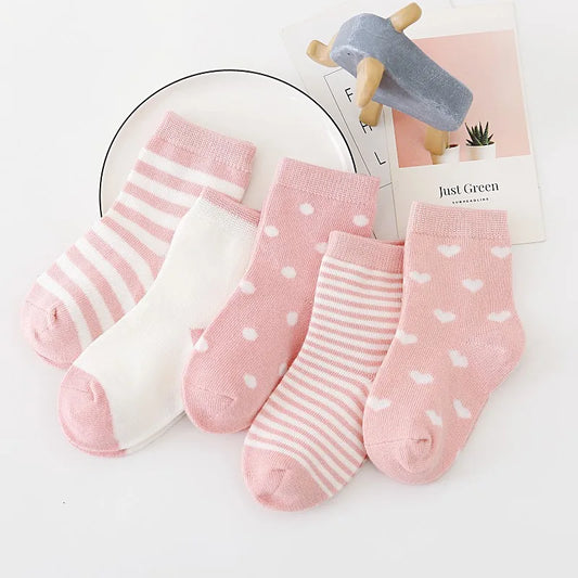 Set of soft toddler socks for boys and girls in pink with stripes and polka dots