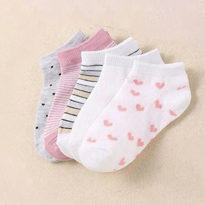 Set of four striped and heart kids socks in pastel colours for comfortable daily wear