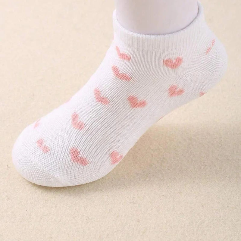 Striped and heart kids socks in white with pink heart patterns for stylish and comfortable wear