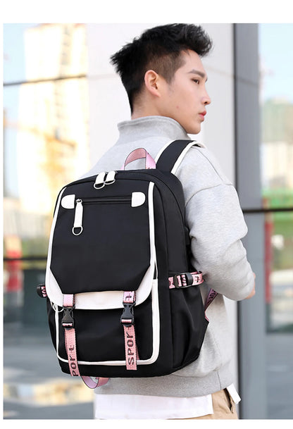 Young man wearing Pink Black Laptop Backpack For Students with pink straps and multiple pockets