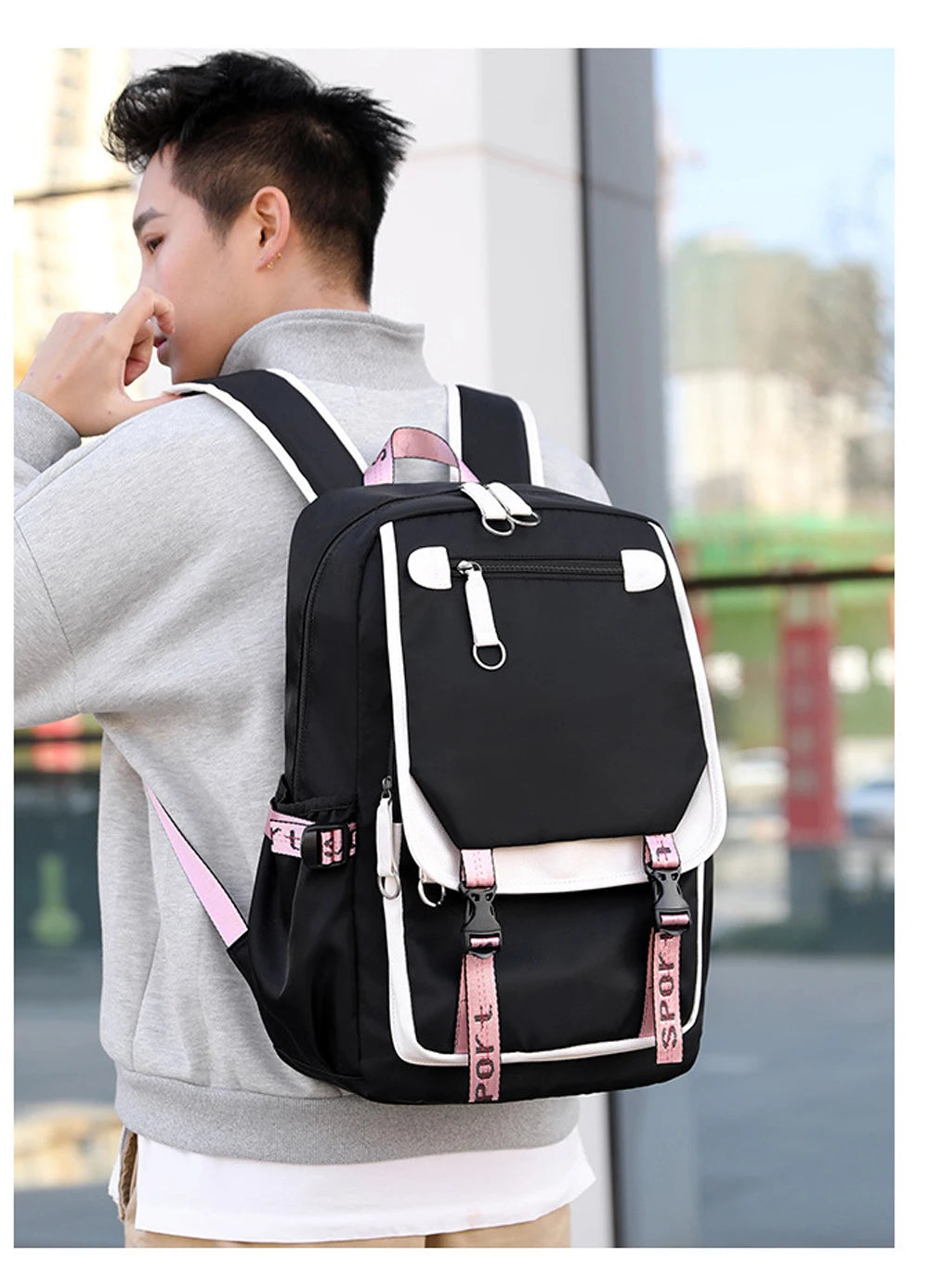 Young student wearing Pink Black Laptop Backpack For Students with pink accents white trim and multiple pockets