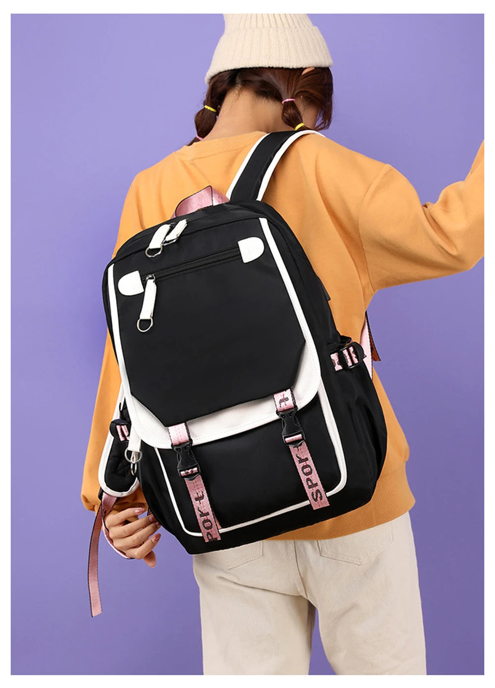 Pink Black Laptop Backpack For Students worn by student, black bag with pink straps and white trim ideal for school