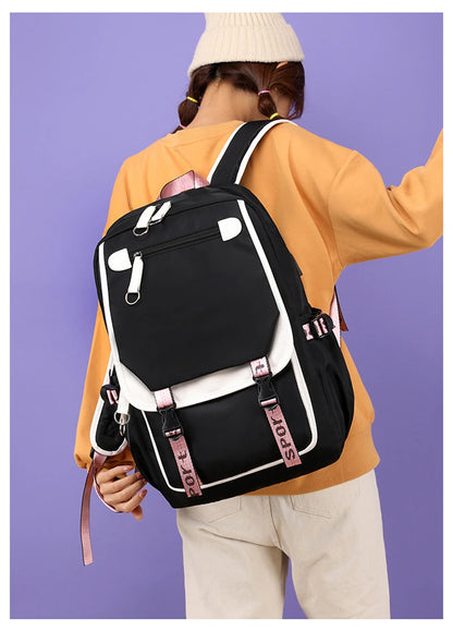 Pink Black Laptop Backpack For Students worn by student, black bag with pink straps and white trim ideal for school
