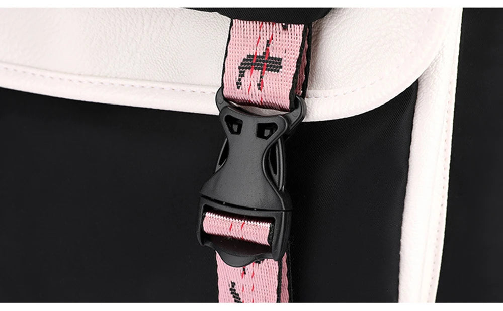 Pink Black Laptop Backpack For Students close up of pink strap buckle on black backpack with white trim