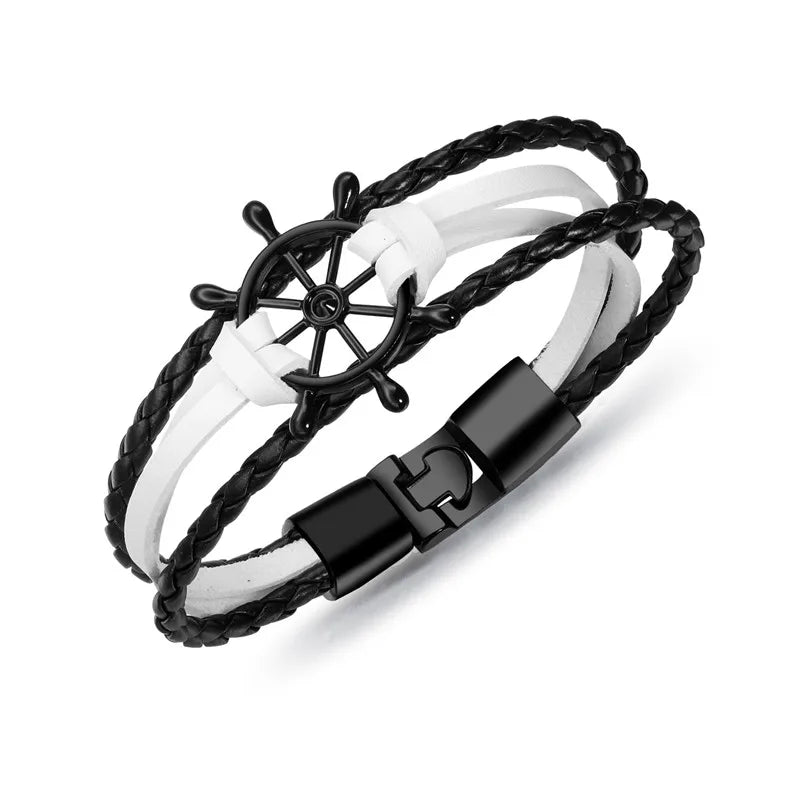 Vintage braided leather charm bracelet featuring a black steering wheel pendant for a nautical style