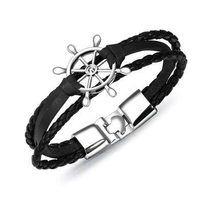 Vintage braided leather charm bracelet with silver ship wheel clasp for nautical enthusiasts