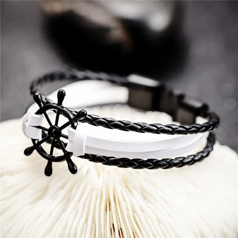 Vintage braided leather charm bracelet with black and white design and anchor detail