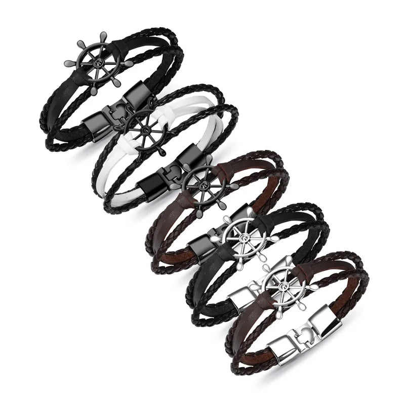 Set of vintage braided leather charm bracelets in various colours with ship wheel charms