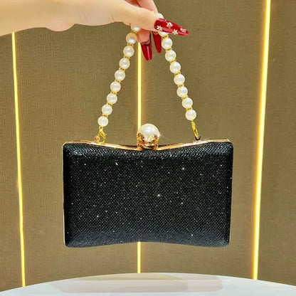 Elegant black wedding beaded sequin handbag with a pearl handle and sparkling details