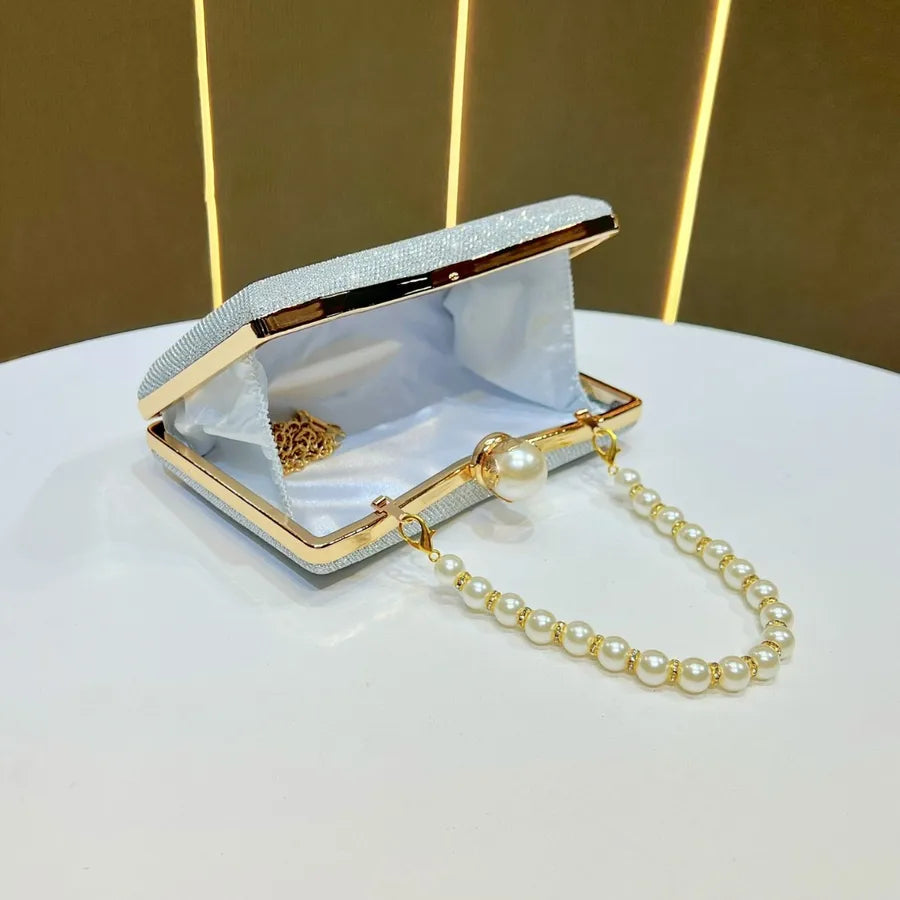 Elegant wedding beaded sequin handbag with pearl chain and gold accents for special occasions