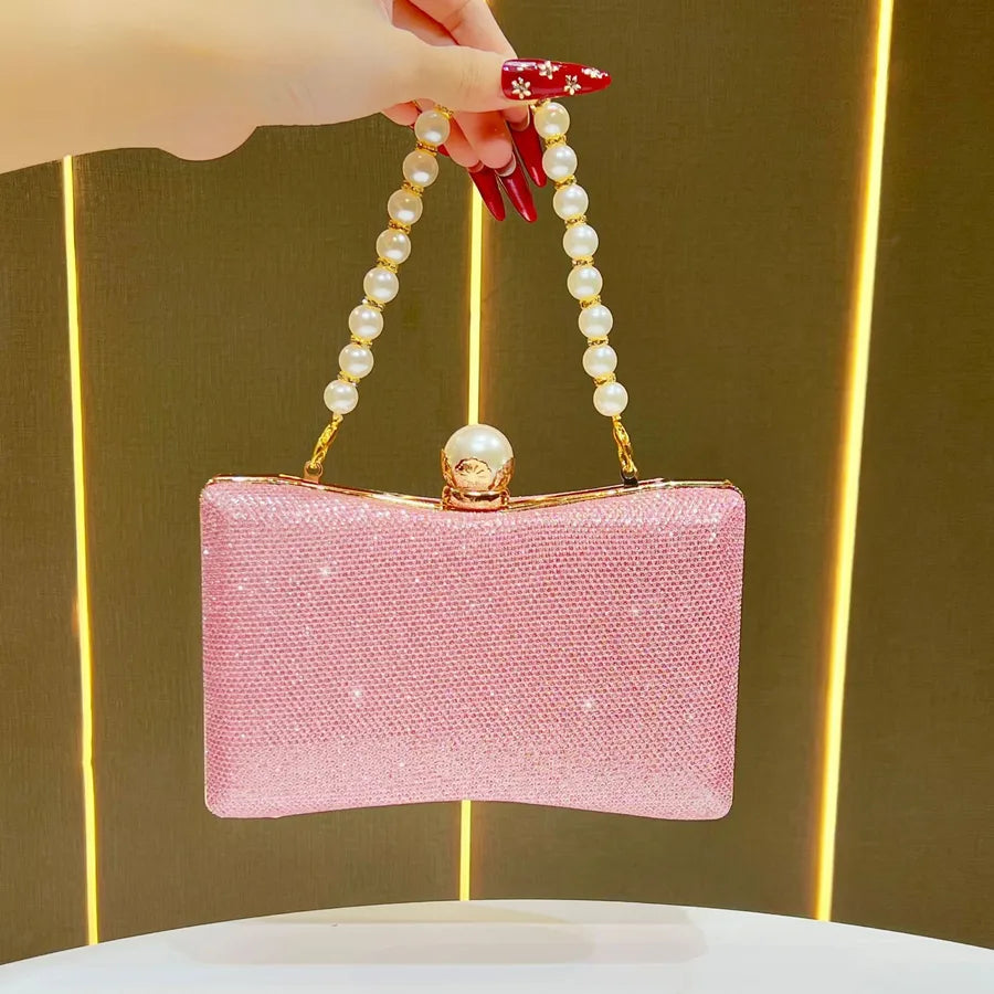 Pink wedding beaded sequin handbag with a pearl handle and stylish clasp for elegant occasions