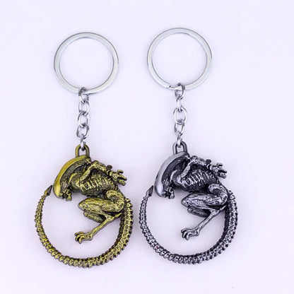 Xenomorph Queen key ring in silver and gold finish featuring detailed alien design