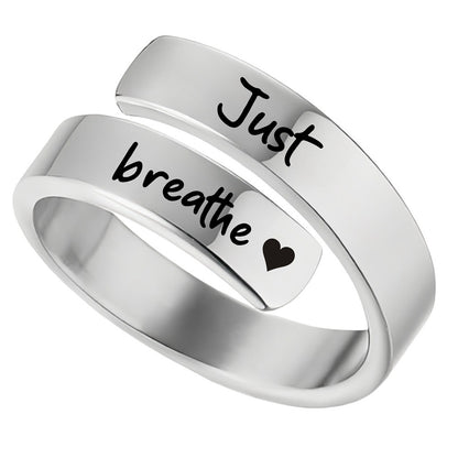 silver adjustable wrap ring just breathe engraved ring with black script engraving and heart detail for calming