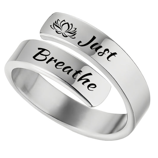 Silver wraparound ring with lotus motif and Just Breathe engraving for calm wearable reminder just breathe engraved ring
